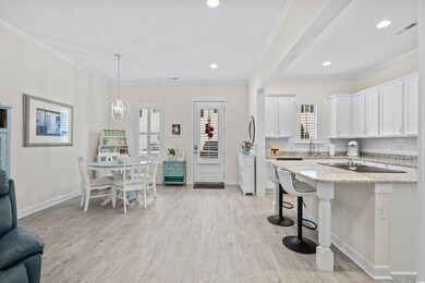 Kitchen with a healthy amount of sunlight, light s