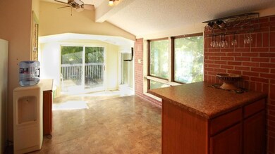 Eat In Kitchen Area with Sliding Glass Doors to Ba