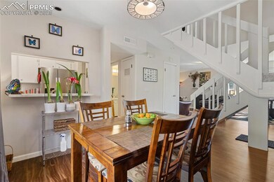 Dining space with visible vents, stairs, baseboard