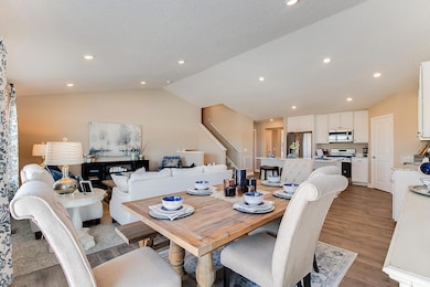 Spacious and well-lit dining area just off of the kitchen! Model home photo, colors and selections may vary.