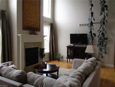 2nd view of living room with electric log fireplac