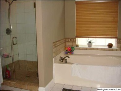 Separate shower and jetted tub, double vanities.
