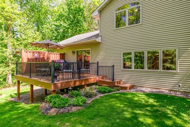 Step out onto the elevated composite deck and take in the tranquil views of your expansive backyard oasis.