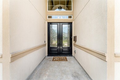 Grand entry with double front door covered patio w