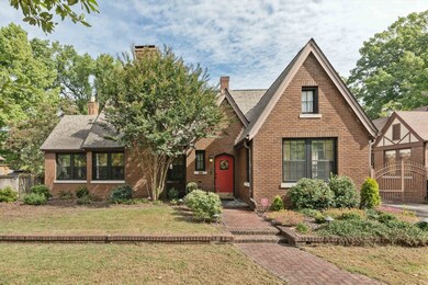 English style home with a front yard