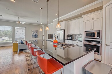 This spacious kitchen features large windows, high