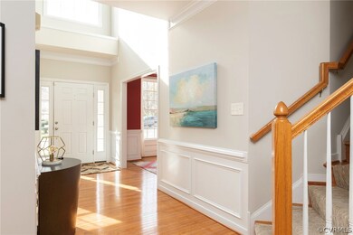 2 story grand foyer with pretty trim detail and wo
