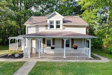 Farmhouse-style home featuring a porch