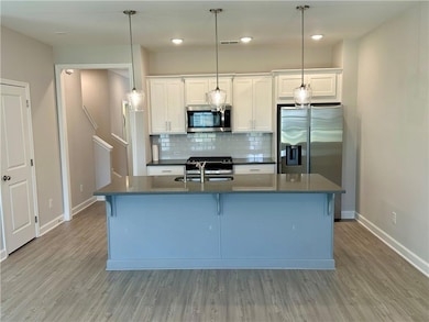 Kitchen featuring appliances with stainless steel 