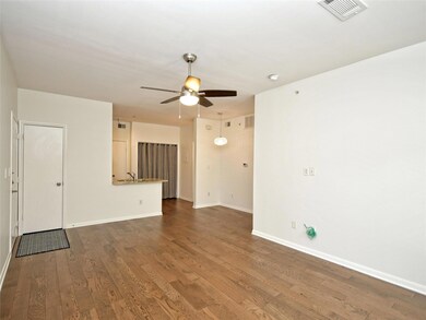 Unfurnished living room with visible vents, wood 