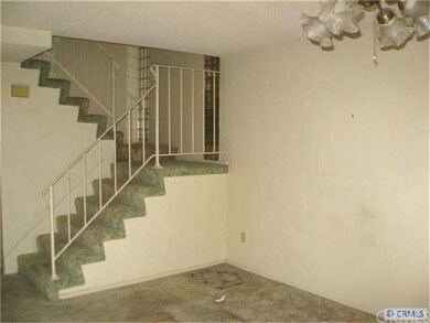 Dining Area Off Kitchen and Stairway