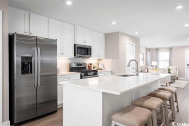 Kitchen featuring light hardwood / wood-style floo