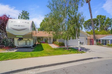 front of home with RV
area
