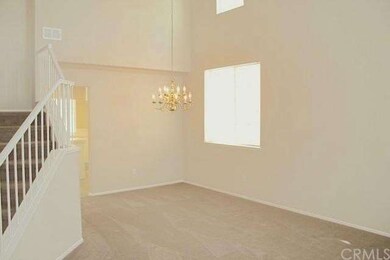 The living room also has 2-story high ceilings. Th