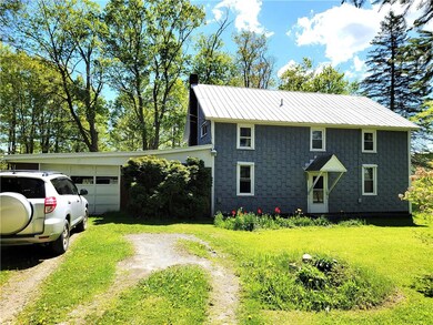Front Of Home With One Car Attached Garage