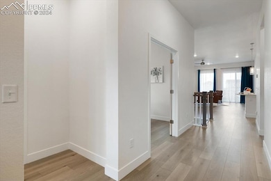 Corridor featuring light hardwood / wood-style flo