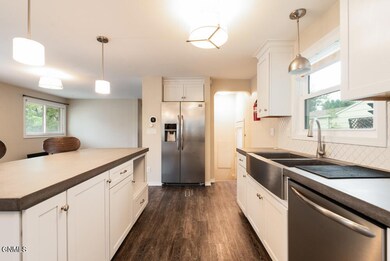Kitchen view to back door & stairs