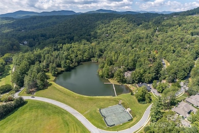 View of the lake and tennis courts at Straus Park
