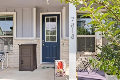 View of exterior entry with board and batten sidi
