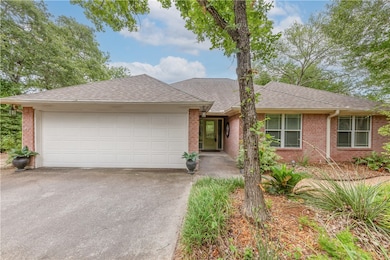 Single story home with brick siding, an attached g