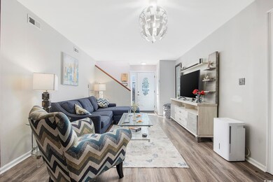 Living room featuring dark wood-type flooring and 