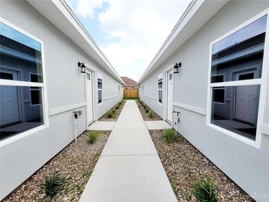 View of home's exterior with fence and stucco siding