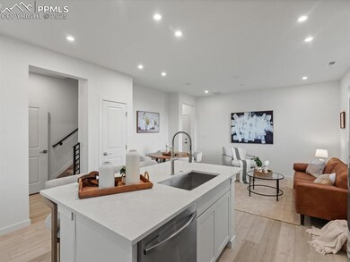 Kitchen featuring open floor plan, recessed lighting, stainless steel dishwasher, light wood-style flooring, and a center island with sink