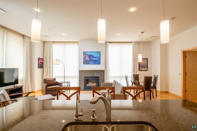 Living room with light hardwood / wood-style floor