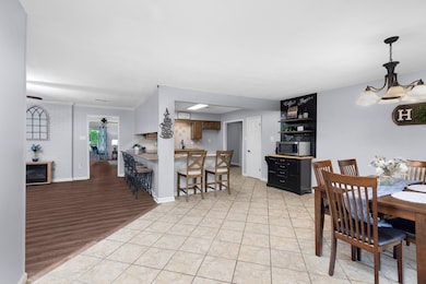 Seating areas along both sides of the countertops along with plenty of space for a table and chairs providing extra seating for dining. Coffee bar included.