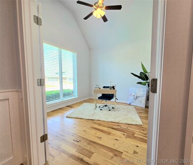 Office front room of home. French doors with windo