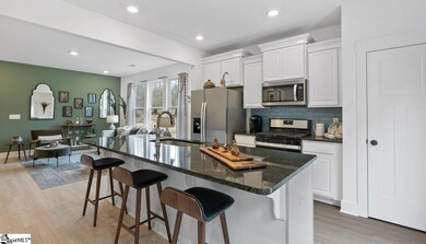 Upgraded white cabinets and stainless gas applianc
