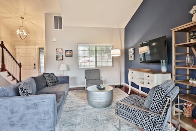 You will be greeted by light and bright Family Room featuring Vaulted Ceilings. Entering the home looking back at front door...stairs lead to upstairs (2) bedrooms and huge bonus room over the 2-car garage.