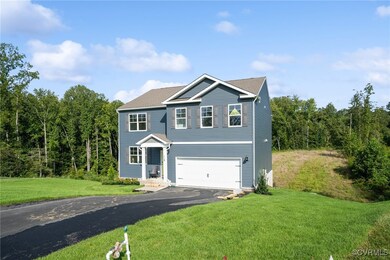 View of front facade featuring a garage and a fron