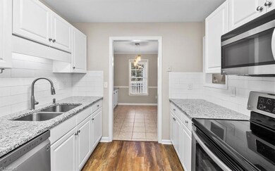 Beautiful kitchen with granite countertops and stainless steel appliances!
