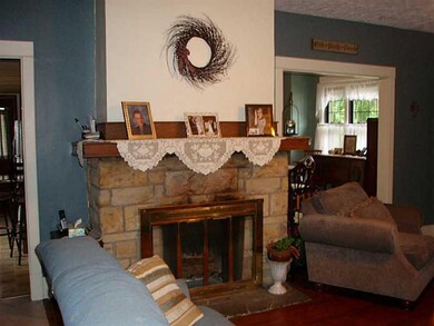 Living Room. Stone and log burning fire place warm