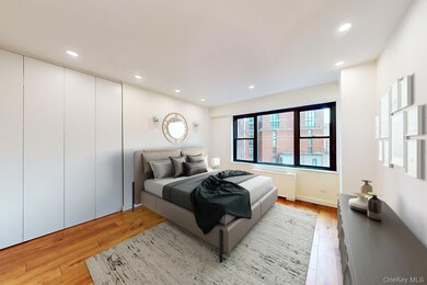 Bedroom featuring light wood-style flooring and recessed lighting