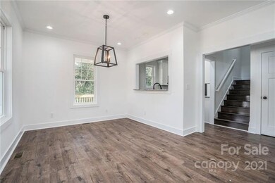 Front entrance looking to stairwell and kitchen