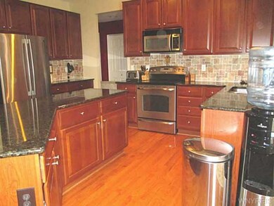 Kitchen. Cabinets feature roll-out drawers.  Pantr