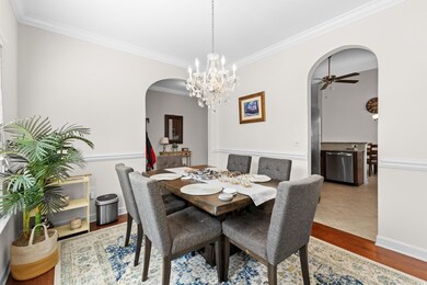 Dining area with ceiling fan, wood-type flooring, 