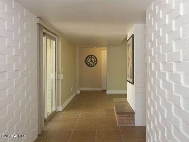 Entry way with brick wall detail