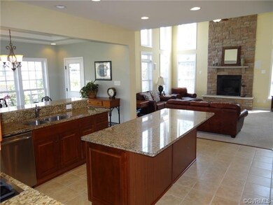 Spacious kitchen featuring ceramic tile floor, gra