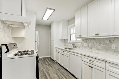 Remodeled Kitchen boasts marble counters & backspl