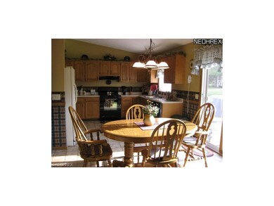 The home features a spacious eat-in kitchen with s