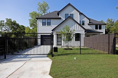 View of front of house with a gate, board and bat