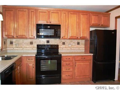 Kitchen. New maple kitchen, tumbled marble backspl