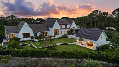 View of front of property with a yard and stucco s