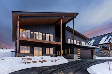 Contemporary house with a balcony and a garage