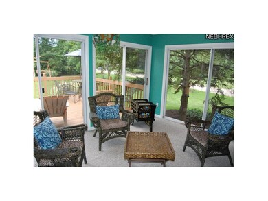 Charming 3 season sun room opens to expansive deck