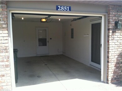 Attached garage with two separate entry doors to l