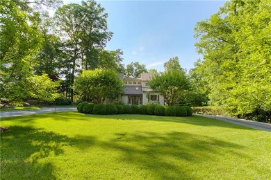 Lushly landscaped front yard with circular drive!